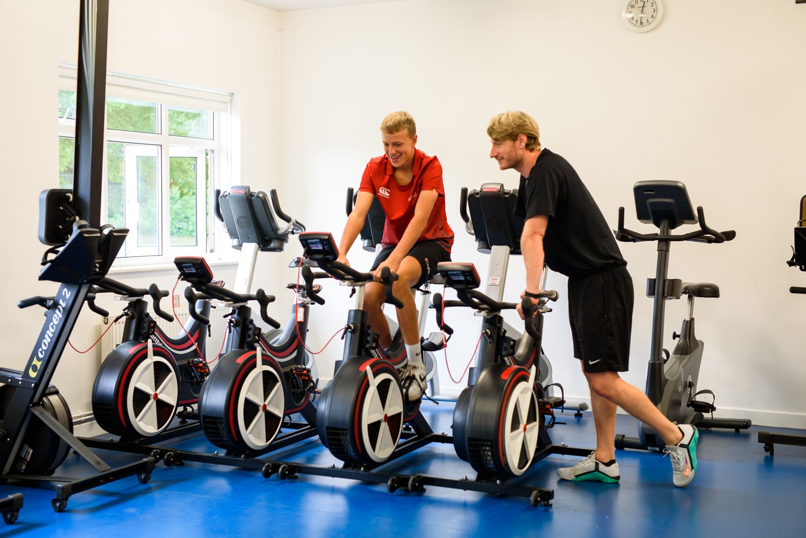 Sports Scholar receiving 1-1 coaching with a Sports Coach in the school gym